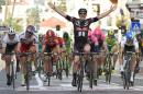 John Degenkolb of Germany reacts as he crosses the finish line to win the Milan-San Remo classic in San Remo, Italy, Sunday, March 22, 2015, edging defending champion Alexander Kristoff on a wet and rainy course for the biggest win of his career. Degenkolb burst through the middle in the closing meters to win the 293-kilometer (182-mile) race in 6 hours, 46 minutes, 16 seconds after Kristoff had started his sprint too early. (AP Photo/Daniel Dal Zennaro, Ansa) ITALY OUT