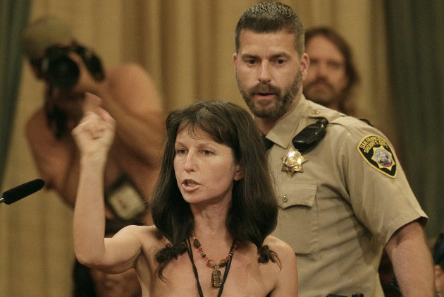 Protester Gypsy Taub speaks out against the Board of Supervisors decision to ban public nakedness while naked at City Hall in San Francisco, Tuesday, Nov. 20, 2012. San Francisco lawmakers on Tuesday narrowly approved a proposal to ban public nakedness, rejecting arguments that the measure would eat away at a reputation for tolerance enjoyed by a city known for flouting convention and flaunting its counter-culture image. The 6-5 Board of Supervisors vote means that exposed genitals will be prohibited in most public places, including streets, sidewalks and public transit. (AP Photo/Jeff Chiu)