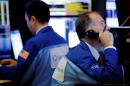 Wall Street dips as telecoms slump; AmEx surges