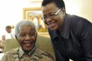 FILE This May 16, 2011 file photo supplied by the South African Government Communications and Information Services, GCIS, shows former South African President Nelson Mandela and his wife Graca Machel after they cast an early ballot in upcoming local elections at his home in Johannesburg, South Africa. South Africa's president has visited former leader Nelson Mandela in a hospital, and the presidency says Mandela continues to respond to treatment. The office of President Jacob Zuma says he saw Mandela on Saturday, Dec. 22, 2012, in Pretoria, the capital, and assured the anti-apartheid icon that he has the support of all South Africans and the world. Mandela, who is 94, has been hospitalized since Dec. 8. He was diagnosed with a lung infection and also had gallstone surgery. (AP Photo/Elmond Jiyane-GCIS, File)