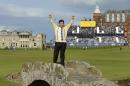 England's Nick Faldo waves as he poses for photographers on the Swilcan Bridge during the second round of the British Open Golf Championship at the Old Course, St. Andrews, Scotland, Friday, July 17, 2015. (AP Photo/David J. Phillip)