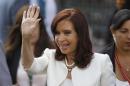 Kirchner waves to the media in Santiago