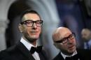 Italian designers Stefano Gabbana stands next to Domenico Dolce as they talk to the media during a party in Shanghai