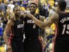Miami Heat's Dwyane Wade, left, LeBron James (6) and Mario Chalmers celebrate during the second half of Game 4 of their NBA basketball Eastern Conference semifinal playoff series against the Indiana Pacers, Sunday, May 20, 2012, in Indianapolis. Miami won 101-93. (AP Photo/Darron Cummings)
