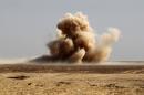 Smoke rises after a mortar shell hit an area close to an Iraqi army position near the village of Tall al-Tibah, some 30 kilometres south of Mosul, on October 19, 2016