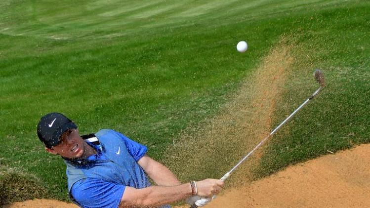 Rory McIlroy of Northern Ireland plays a shot from a bunker during the third day of the BMW Shanghai Masters on October 26, 2013