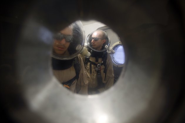 Crew members wait in the airlock …