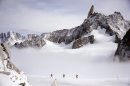 Three climbers walk at an altitude of 3400 metres on September 11, 2013 near the Dent du Géant (Giant's tooth), in the Mont Blanc massif in France and Italy