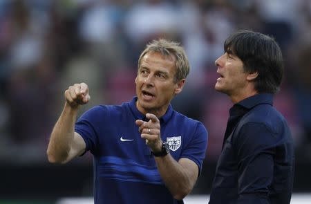 Coaches Loew of Germany and Klinsmann of the U.S. chat before their international friendly soccer match in Cologne