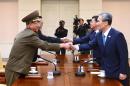 Senior officials from South Korea (R) and North Korea (L) meet for urgent talks on August 22, 2015 as a crisis on the penisula escalated to the brink of armed conflict
