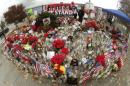 People visit a makeshift memorial for the victims of last week's shooting in San Bernardino, California