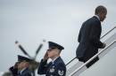 US President Barack Obama boards Air Force One at Andrews Air Force Base October 7, 2014 in Maryland