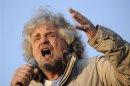Five-Star Movement leader and comedian Grillo gestures during a rally in Turin