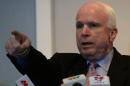 US Senator John McCain takes questions during a press conference in Hanoi, on August 8, 2014