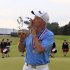 Roger Chapman kisses the Francis D. Ouimet Memorial Senior Open Championship Trophy after winning the U.S. Senior Open at the Indianwood Golf and Country Club in Lake Orion, Mich., Sunday, July 15, 2012. (AP Photo/Carlos Osorio)