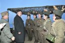 North Korean leader Kim Jong-Un talks with soldiers of the Korean People's Army (KPA) taking part in landing and anti-landing drills in the eastern sector of the front and the east coastal area