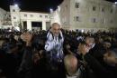 A prisoner released from an Israeli prison is welcomed by relatives in the West Bank city of Ramallah