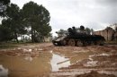 A damaged tank is seen at the Free Syrian Army controlled infantry college in the country side in Aleppo