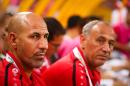 Iraq coach Radhi Shenaishil (left) looks on during the first round Asian Cup match against Japan in Brisbane on January 16, 2015