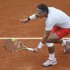Nadal of Spain hits a return to Klizan of Slovakia during their men's singles match at the French Open tennis tournament in Paris