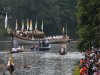 The royal barge Gloriana carries the Olympic flame in a cauldron on board, as it leaves Hampton Court Palace in London, as it makes its way along the river Thames into central London on the final day of the Torch Relay, Friday, July 27, 2012. (AP Photo/Sang Tan)