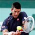 Djokovic of Serbia returns the ball to Devilder of France during the French Open tennis tournament at the Roland Garros stadium in Paris