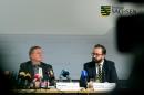 Rolf Jacob, director of the prison in Leipzig, left, and Saxony's state justice minister Sebastian Gemkow attend a press conference in Dresden, eastern Germany, Thursday, Oct. 13, 2016 after the death of 22-year-old Syrian man Jaber Albakr suspected of planning an Islamic extremist bombing attack strangled himself by tying his shirt to the bars of his jail cell. (Arno Burgi/dpa via AP)