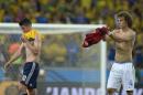 Brazil's David Luiz, right, applauds Colombia's James Rodriguez at the end of the World Cup quarterfinal soccer match between Brazil and Colombia at the Arena Castelao in Fortaleza, Brazil, Friday, July 4, 2014. Brazil won the match 2-1. (AP Photo/Manu Fernandez)