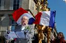 France's far right National Front party founder Jean-Marie Le Pen delivers a speech during the traditional May Day tribute to Joan of Arc (Jeanne d'Arc) in front of her statue in Paris