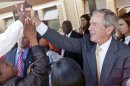 In this photo provided by the George W. Bush Presidential Center, former President George W. Bush and his wife, Laura Bush stop to talk with people who have lined the hallways of the Princess Marina Hospital in Gaborone, Botswana, on Thursday, July 5, 2012. The former president and his wife visited Africa for a week to promote a partnership between the George W. Bush Institute, the U.S. President's Emergency Plan for AIDS Relief, UNAIDS and Susan G. Komen for the Cure, that aims to fight cervical and breast cancer in sub-Saharan Africa. (AP Photo/George W. Bush Presidential Center, Shealah Craighead)