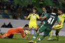 Sporting's goalkeeper Rui Patricio, left, makes a save after a shot by Maribor's Aleksander Rajcevic, right, during a Champions League Group G soccer match between Sporting and Maribor at Sporting's Alvalade stadium, in Lisbon, Tuesday, Nov. 25, 2014. (AP Photo/Francisco Seco)