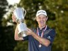 England's Justin Rose raises the U.S. Open Trophy after winning the 2013 U.S. Open golf championship at the Merion Golf Club in Ardmore