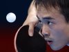 USA's Timothy Wang takes a shot against Korea's Kim Song Nam during a table tennis preliminary round match at the 2012 Summer Olympics, Saturday, July 28, 2012, in London. (AP Photo/Sergei Grits)