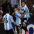 Lionel Messi celebrates with Sergio Aguero and Angel di Maria after scoring against Uruguay during their 2014 World Cup qualifying soccer match in Mendonza