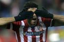 Atletico's Diego Costa celebrates scoring the opening goal during a Champions League, round of 16, second leg, soccer match between Atletico Madrid and AC Milan at the Vicente Calderon stadium in Madrid, Tuesday March 11, 2014. (AP Photo/Paul White)