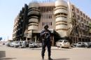 A soldiers stands guard in front of Splendid Hotel in Ouagadougou