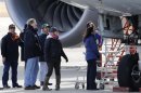 U.S. aviation authorities, unidentified Boein Co. official and members of Japan Transport Safety Board inspect ANA Boeing Co's 787 Dreamliner plane, which made an emergency landing on Wednesday, in Takamatsu