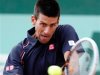 Djokovic of Serbia returns the ball to Devilder of France during the French Open tennis tournament at the Roland Garros stadium in Paris