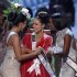 Miss USA Culpo is congratulated by Miss Teen USA West and Miss Universe 2011 Lopes during Miss Universe pageant in Las Vegas