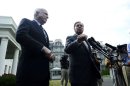 US Senator John McCain (L) and Senator Lindsey Graham at the White House in Washington on September 2, 2013
