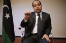 Libya's new Prime Minister Ahmed Maiteeq talks during an interview with Reuters in Tripoli