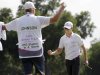 Zach Johnson, right, celebrates with his caddie Damon Green after winning the PGA Colonial golf tournament following his final putt on the 18th hole, Sunday, May 27, 2012, in Fort Worth, Texas. (AP Photo/LM Otero)