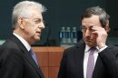 Mario Monti and Mario Draghi attend an eurozone finance ministers meeting at the EU Council in Brussels
