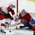 Montreal Canadiens goalie Peter Budaj makes a save against Carolina Hurricanes Jiri Tlusty during first period NHL hockey action in Montreal