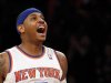 New York Knicks forward Carmelo Anthony reacts after hitting a three-point shot against the Boston Celtics in the first quarter of Game 1 of their NBA Eastern Conference Quarterfinals basketball playoff series in New York