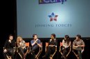 U.S. First Lady Michelle Obama interacts with iCarly cast members after a screening of "iMeet The First Lady" in Arlington
