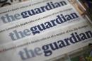 Copies of the Guardian newspaper are displayed at a news agent in London