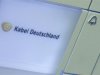 The logo of Kabel Deutschland is written on a door bell at the Kabel Deutschland playout center in Frankfurt