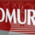Pedestrians are reflected in a sign displayed outside a Nomura Securities branch in Tokyo