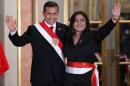 Peruvian President Ollanta Humala (L) waves with Prime Minister Ana Jara during the swearing-in ceremony in Lima on July 22, 2014